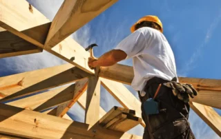 man doing construction with wood